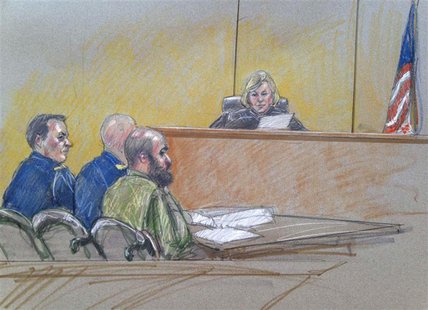 U.S. Army Major Nidal Hasan (C), accused of killing 13 soldiers in a 2009 Fort Hood shooting rampage, is seen in a courtroom sketch as he si U.S. Army Major Nidal Hasan (C), accused of killing 13 soldiers in a 2009 Fort Hood shooting rampage, is seen in a courtroom sketch as he si