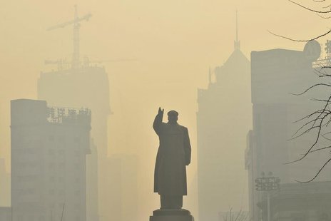 A statue of China's late Chairman Mao Zedong is seen in front of buildings during a hazy day in Shenyang, Liaoning province, May 7, 2013. RE A statue of China's late Chairman Mao Zedong is seen in front of buildings during a hazy day in Shenyang, Liaoning province, May 7, 2013. RE