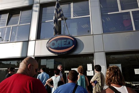 People wait outside a Greek Manpower Employment Organisation (OAED) office in a northern suburb of Athens July 11, 2013. REUTERS/Yorgos Kara People wait outside a Greek Manpower Employment Organisation (OAED) office in a northern suburb of Athens July 11, 2013. REUTERS/Yorgos Kara