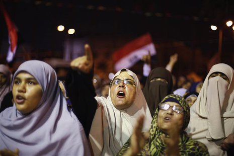 Supporters of the deposed Egyptian President Mohamed Mursi shout anti-army slogans during a sit-in protest in Cairo July 11, 2013. REUTERS/S Supporters of the deposed Egyptian President Mohamed Mursi shout anti-army slogans during a sit-in protest in Cairo July 11, 2013. REUTERS/S