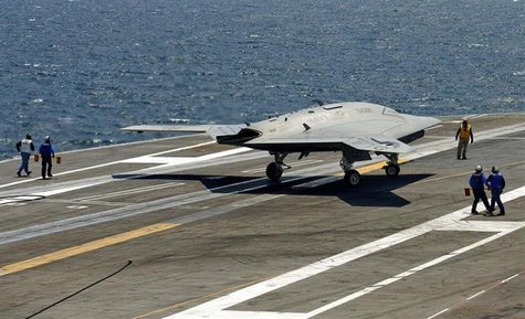 An X-47B pilot-less drone combat aircraft comes to a stop after landing on the deck of the USS George H.W. Bush aircraft carrier in the Atla An X-47B pilot-less drone combat aircraft comes to a stop after landing on the deck of the USS George H.W. Bush aircraft carrier in the Atla