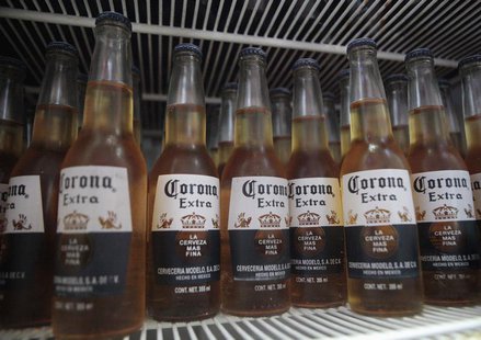 Bottles of Corona beer sit in a fridge at a bar in Cancun June 29, 2012. REUTERS/Victor Ruiz Garcia Bottles of Corona beer sit in a fridge at a bar in Cancun June 29, 2012. REUTERS/Victor Ruiz Garcia