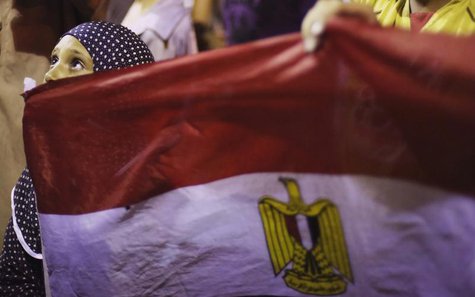 A girl holds Egypt's flag as she attends a sit-in protest organized by supporters of the deposed Egyptian President Mohamed Mursi in Cairo J A girl holds Egypt's flag as she attends a sit-in protest organized by supporters of the deposed Egyptian President Mohamed Mursi in Cairo J