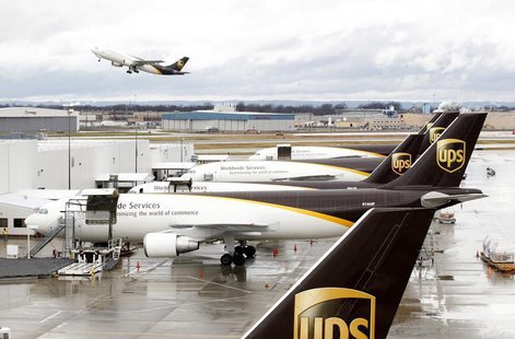 United Parcel Service aircrafts are being loaded with air containers full of packages bound for their final destination at the UPS Worldport United Parcel Service aircrafts are being loaded with air containers full of packages bound for their final destination at the UPS Worldport