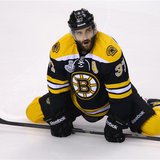 Boston Bruins' Patrice Bergeron stretches during the warmup before playing the Chicago Blackhawks in Game 6 of their NHL Stanley Cup Finals Boston Bruins' Patrice Bergeron stretches during the warmup before playing the Chicago Blackhawks in Game 6 of their NHL Stanley Cup Finals
