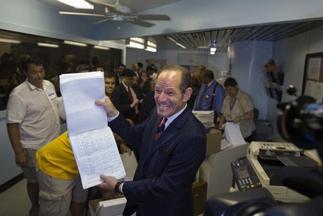 Former New York Governor Eliot Spitzer displays to the media, signatures which he delivered to the board of elections office, in New York Ju Former New York Governor Eliot Spitzer displays to the media, signatures which he delivered to the board of elections office, in New York Ju