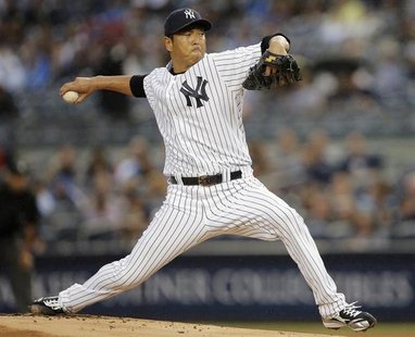 New York Yankees starting pitcher Hiroki Kuroda throws a pitch to the Minnesota Twins in the first inning of their MLB American League baseb New York Yankees starting pitcher Hiroki Kuroda throws a pitch to the Minnesota Twins in the first inning of their MLB American League baseb