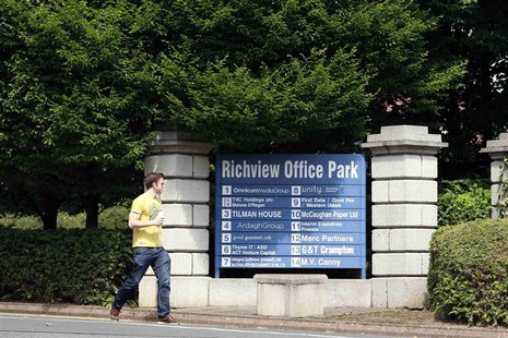 A man walks past the Richview Office Park which houses Western Union offices in Dublin July 8, 2013. REUTERS/Cathal McNaughton A man walks past the Richview Office Park which houses Western Union offices in Dublin July 8, 2013. REUTERS/Cathal McNaughton