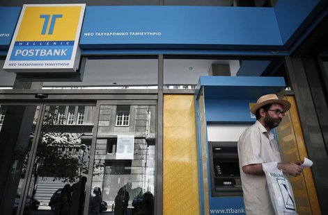 A man leaves an ATM of a Hellenic Post bank branch in Athens July 12, 2013. REUTERS/Yorgos Karahalis A man leaves an ATM of a Hellenic Post bank branch in Athens July 12, 2013. REUTERS/Yorgos Karahalis