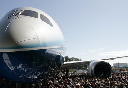 The Boeing 787 Dreamliner aircraft is surrounded by employees and special guests during its world premiere outside the Boeing assembly plant The Boeing 787 Dreamliner aircraft is surrounded by employees and special guests during its world premiere outside the Boeing assembly plant