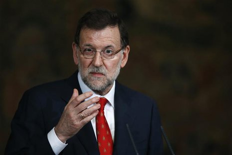 Spain's Prime Minister Mariano Rajoy gestures during a presentation on social action entities at the Moncloa Palace in Madrid July 11, 2013. Spain's Prime Minister Mariano Rajoy gestures during a presentation on social action entities at the Moncloa Palace in Madrid July 11, 2013.