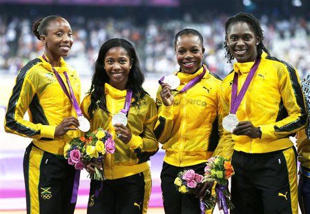 (L-R) Jamaica's Sherone Simpson, Shelly-Ann Fraser-Pryce, Veronica Campbell-Brown and Kerron Stewart pose with their silver medals in the wo (L-R) Jamaica's Sherone Simpson, Shelly-Ann Fraser-Pryce, Veronica Campbell-Brown and Kerron Stewart pose with their silver medals in the wo