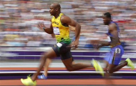 Asafa Powell of Jamaica runs on his way to winning his 100m heat round 1 during the London 2012 Olympic Games at the Olympic Stadium August Asafa Powell of Jamaica runs on his way to winning his 100m heat round 1 during the London 2012 Olympic Games at the Olympic Stadium August