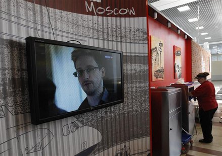 A television screens the image of former U.S. spy agency contractor Edward Snowden during a news bulletin at a cafe at Moscow's Sheremetyevo A television screens the image of former U.S. spy agency contractor Edward Snowden during a news bulletin at a cafe at Moscow's Sheremetyevo
