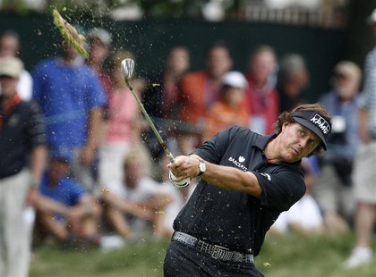 Phil Mickelson of the U.S. makes his second shot on the eighth hole during the final round of the 2013 U.S. Open golf championship at the Me Phil Mickelson of the U.S. makes his second shot on the eighth hole during the final round of the 2013 U.S. Open golf championship at the Me