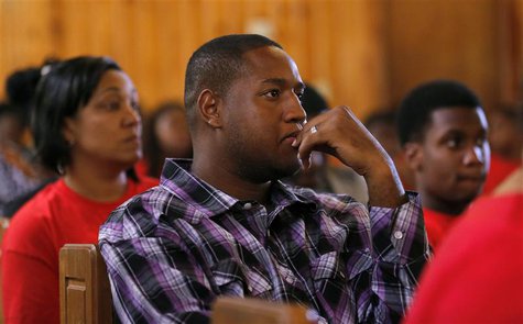 Members of the congregation listen as Pastor Valarie J. Houston makes a statement about the not guilty verdict for George Zimmerman at the A Members of the congregation listen as Pastor Valarie J. Houston makes a statement about the not guilty verdict for George Zimmerman at the A