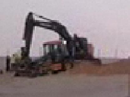 Heavy equipment was rushed to the site to dig the boy out. Heavy equipment was rushed to the site to dig the boy out.