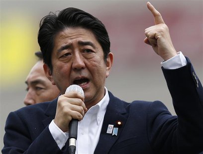 Japan's Prime Minister Shinzo Abe, who is also leader of the ruling Liberal Democratic Party, speaks to voters atop a campaign van in Tokyo Japan's Prime Minister Shinzo Abe, who is also leader of the ruling Liberal Democratic Party, speaks to voters atop a campaign van in Tokyo