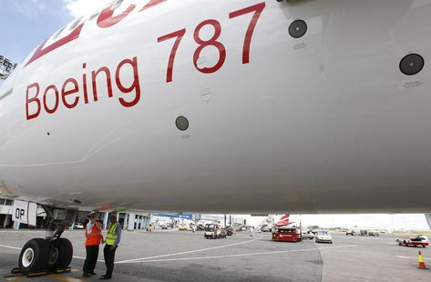 Aviation engineers inspect an Ethiopian Airlines' 787 Dreamliner after it arrived at the Jomo Kenyatta international airport in Kenya’s capi Aviation engineers inspect an Ethiopian Airlines' 787 Dreamliner after it arrived at the Jomo Kenyatta international airport in Kenya’s capi