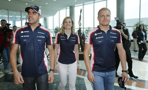 Williams Formula One drivers Pastor Maldonado (L) of Venezuela and Valtteri Bottas (R) of Finland and test-driver Susie Wolff of Britain wal Williams Formula One drivers Pastor Maldonado (L) of Venezuela and Valtteri Bottas (R) of Finland and test-driver Susie Wolff of Britain wal