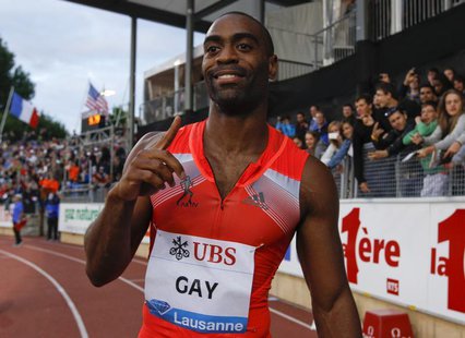 Tyson Gay of the U.S. gestures after winning in the 100m event of the Lausanne Diamond League meeting in Lausanne, July 4, 2013. REUTERS/Den Tyson Gay of the U.S. gestures after winning in the 100m event of the Lausanne Diamond League meeting in Lausanne, July 4, 2013. REUTERS/Den