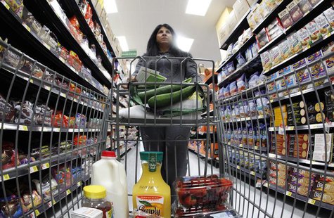 A shopper walks down an aisle in a newly opened Walmart Neighborhood Market in Chicago September 21, 2011. REUTERS/Jim Young A shopper walks down an aisle in a newly opened Walmart Neighborhood Market in Chicago September 21, 2011. REUTERS/Jim Young