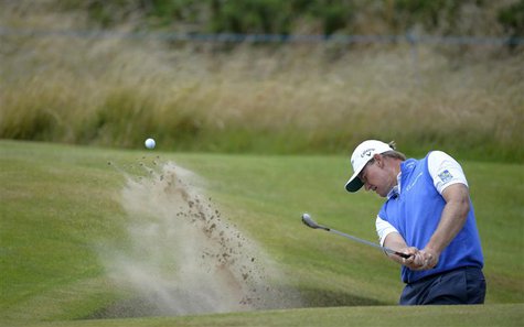 Ernie Els of South Africa hits out of a from a bunker on the third hole during a practice round ahead of the British Open golf championship Ernie Els of South Africa hits out of a from a bunker on the third hole during a practice round ahead of the British Open golf championship