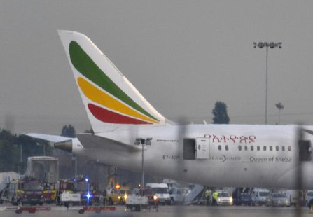 Emergency services attend to a Boeing 787 Dreamliner, operated by Ethiopian Airlines, after it caught fire at Britain's Heathrow airport in Emergency services attend to a Boeing 787 Dreamliner, operated by Ethiopian Airlines, after it caught fire at Britain's Heathrow airport in