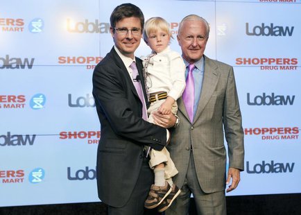 Executive chairman of Loblaw Companies Limited Galen G Weston (L) holds his son Graydon, as they pose with W. Galen Weston (R) in Toronto, J Executive chairman of Loblaw Companies Limited Galen G Weston (L) holds his son Graydon, as they pose with W. Galen Weston (R) in Toronto, J