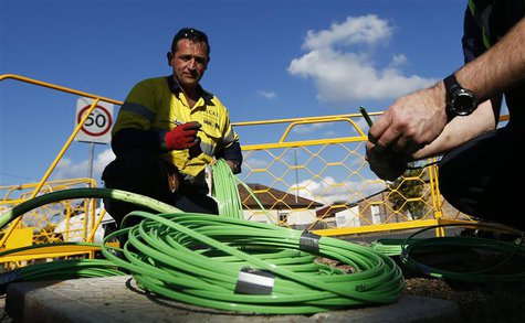 NBN Co. workers arrange fiber-optic cables used in the National Broadband Network in west Sydney July 11, 2013. REUTERS/Daniel Munoz NBN Co. workers arrange fiber-optic cables used in the National Broadband Network in west Sydney July 11, 2013. REUTERS/Daniel Munoz