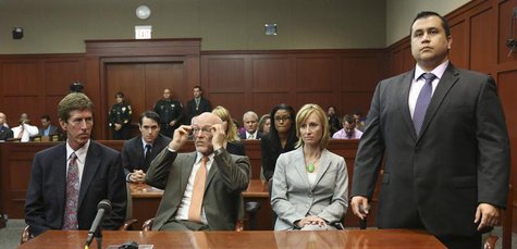 George Zimmerman stands when the jury arrives to deliver the verdict as his attorneys Mark O'Mara (L) and co-counsel, Don West (2nd L) and L George Zimmerman stands when the jury arrives to deliver the verdict as his attorneys Mark O'Mara (L) and co-counsel, Don West (2nd L) and L