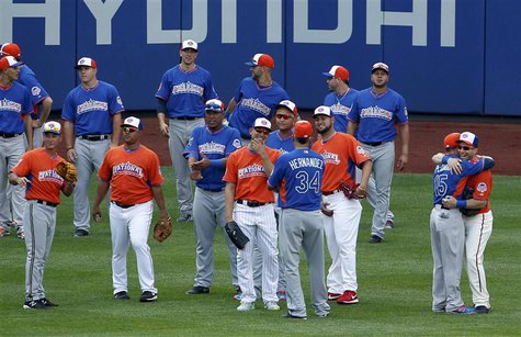 Major League All-Stars greet one another in the outfield during practice before the Major League Baseball All-Star Game Home Run Derby in Ne Major League All-Stars greet one another in the outfield during practice before the Major League Baseball All-Star Game Home Run Derby in Ne