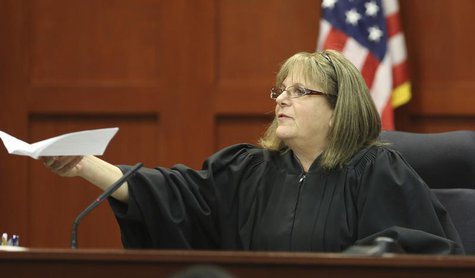 Judge Debra Nelson hands the verdict to the clerk of courts announcing George Zimmerman is not guilty in the 2012 shooting death of Trayvon Judge Debra Nelson hands the verdict to the clerk of courts announcing George Zimmerman is not guilty in the 2012 shooting death of Trayvon