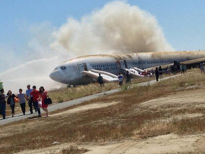 Passengers evacuate the Asiana Airlines Boeing 777 aircraft after a crash landing at San Francisco International Airport in California July Passengers evacuate the Asiana Airlines Boeing 777 aircraft after a crash landing at San Francisco International Airport in California July