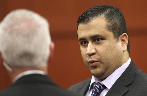 George Zimmerman talks to court security investigator Robert Hemmert for a recess after a jury question during his trial in the shooting dea George Zimmerman talks to court security investigator Robert Hemmert for a recess after a jury question during his trial in the shooting dea