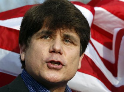 Former Illinois Governor Rod Blagojevich makes a statement to reporters outside his Chicago home one day before reporting to federal prison Former Illinois Governor Rod Blagojevich makes a statement to reporters outside his Chicago home one day before reporting to federal prison