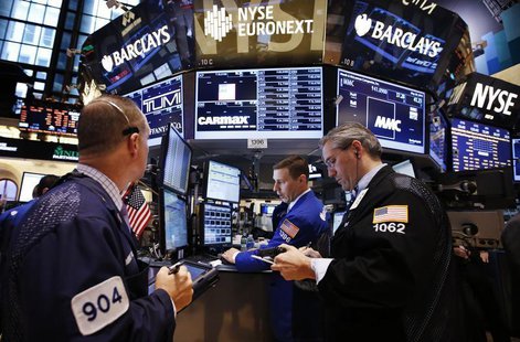 Traders work on the main trading floor of the New York Stock Exchange (NYSE) shortly after the opening bell in New York, May 20, 2013. REUTE Traders work on the main trading floor of the New York Stock Exchange (NYSE) shortly after the opening bell in New York, May 20, 2013. REUTE