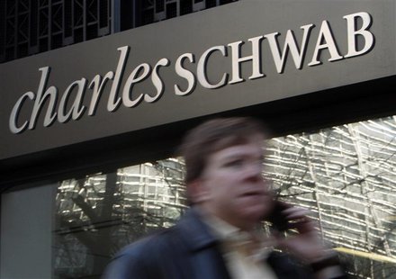 A man walks past a Charles Schwab Investment branch in Washington in this January 19, 2010 files. REUTERS/Jim Young/Files A man walks past a Charles Schwab Investment branch in Washington in this January 19, 2010 files. REUTERS/Jim Young/Files