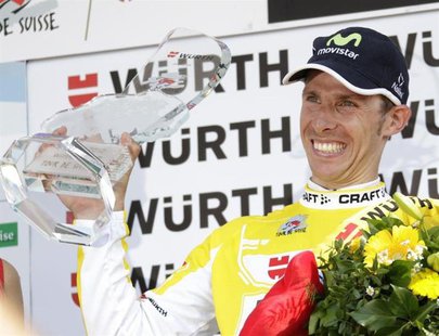 Movistar rider Rui Costa of Portugal celebrates with the winner's trophy on the podium after the ninth and final stage of the Tour de Suisse Movistar rider Rui Costa of Portugal celebrates with the winner's trophy on the podium after the ninth and final stage of the Tour de Suisse