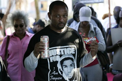 Community activist Najee Ali holds Skittles and an ice tea during a peaceful protest of the acquittal of George Zimmerman for the 2012 shoot Community activist Najee Ali holds Skittles and an ice tea during a peaceful protest of the acquittal of George Zimmerman for the 2012 shoot