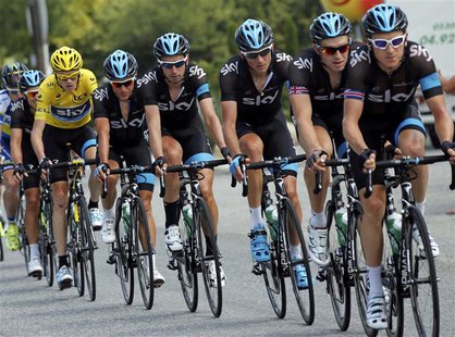 Race leader's yellow jersey holder Team Sky rider Christopher Froome of Britain cycles with team mates during the 168 km sixteenth stage of Race leader's yellow jersey holder Team Sky rider Christopher Froome of Britain cycles with team mates during the 168 km sixteenth stage of