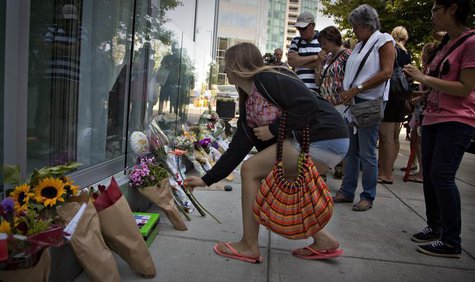 People gather at a small memorial to Canadian actor Cory Monteith outside the Fairmont Pacific Rim Hotel in Vancouver, British Columbia July People gather at a small memorial to Canadian actor Cory Monteith outside the Fairmont Pacific Rim Hotel in Vancouver, British Columbia July