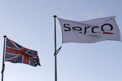 A Serco flag is seen flying alongside a Union flag outside Doncaster Prison in northern England in this December 13, 2011 file photograph. R A Serco flag is seen flying alongside a Union flag outside Doncaster Prison in northern England in this December 13, 2011 file photograph. R