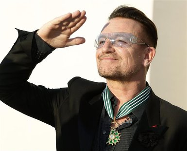 Musician Bono, lead singer of the band U2, reacts after being awarded as Commandeur des Arts et lettres (Commander in the Order of Arts and Musician Bono, lead singer of the band U2, reacts after being awarded as Commandeur des Arts et lettres (Commander in the Order of Arts and