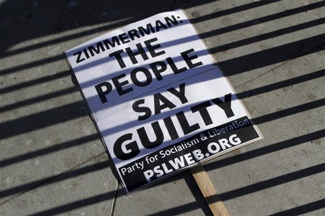 A sign lays on the ground at a protest of the acquittal of George Zimmerman for the 2012 shooting death of Trayvon Martin, in Los Angeles, C A sign lays on the ground at a protest of the acquittal of George Zimmerman for the 2012 shooting death of Trayvon Martin, in Los Angeles, C