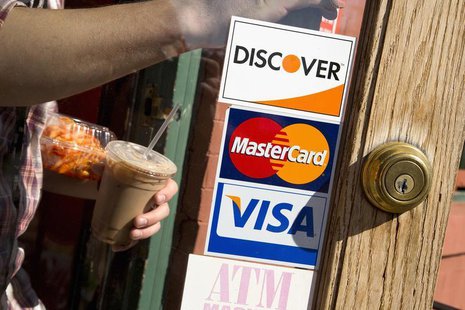 A coffee shop displays signs for Visa, MasterCard and Discover, in Washington, May 1, 2013. REUTERS/Jonathan Ernst A coffee shop displays signs for Visa, MasterCard and Discover, in Washington, May 1, 2013. REUTERS/Jonathan Ernst