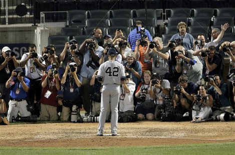New York Yankees pitcher Mariano Rivera poses for photographers with his trophy after being named MVP of the 2013 All-Star Game following Ma New York Yankees pitcher Mariano Rivera poses for photographers with his trophy after being named MVP of the 2013 All-Star Game following Ma