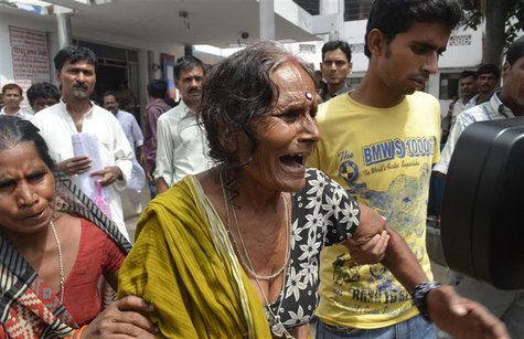 A woman cries after her grandson, who consumed spurious meals at a school on Tuesday, died at a hospital in the eastern Indian city of Patna A woman cries after her grandson, who consumed spurious meals at a school on Tuesday, died at a hospital in the eastern Indian city of Patna