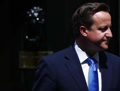 Britain's Prime Minister David Cameron waits to welcome his Italian counterpart Enrico Letta on the doorstep of 10 Downing Street in central Britain's Prime Minister David Cameron waits to welcome his Italian counterpart Enrico Letta on the doorstep of 10 Downing Street in central