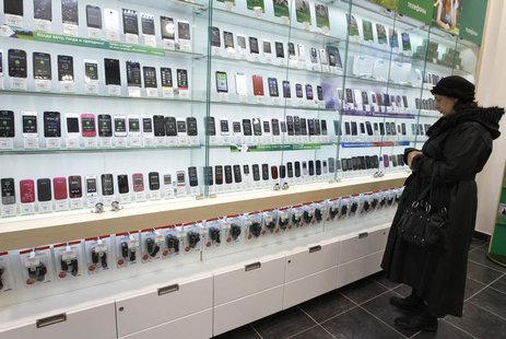 A customer looks at a display of handsets for sale inside a MegaFon shop in St. Petersburg November 15, 2012. REUTERS/Alexander Demianchuk A customer looks at a display of handsets for sale inside a MegaFon shop in St. Petersburg November 15, 2012. REUTERS/Alexander Demianchuk